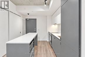 Toronto (Stonegate-Queensway) condo for rent - A kitchen with white countertops and grey cabinets.