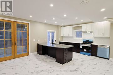 Milton (Cl Clarke) apartment for rent - A modern kitchen with a large island and a sink.