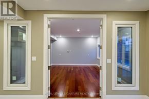 Milton (Cl Clarke) apartment for rent - A room with a wooden floor and white walls.