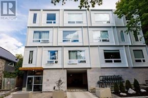 Ottawa condo for rent - A modern building with the number 22 on the front door.