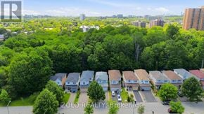 Toronto (West Hill) apartment for rent - A bird's eye view of a residential area with houses and trees.