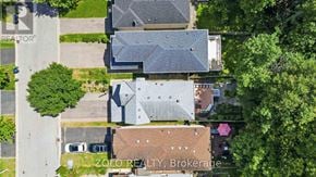 Toronto (West Hill) apartment for rent - A bird's eye view of a residential area with houses and trees.