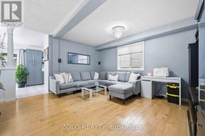 Toronto (West Hill) apartment for rent - A living room with a grey couch and a coffee table.