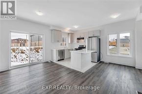Barrie (Painswick South) townhouse for rent - A spacious kitchen and living room with EXP REALTY, Brokerage logo.