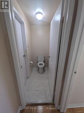 Toronto (L'amoreaux) townhouse for rent - A small bathroom with a toilet and a light on the ceiling.