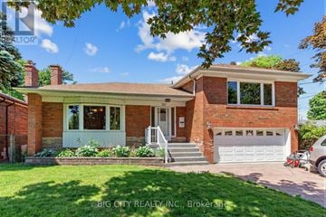 Toronto (Ionview) apartment for rent - A house with a brick facade and a white garage door.