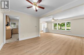 Toronto (Ionview) apartment for rent - A spacious room with a ceiling fan and hardwood flooring.