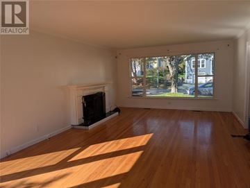 St. John's apartment for rent - A living room with a fireplace and a large window.