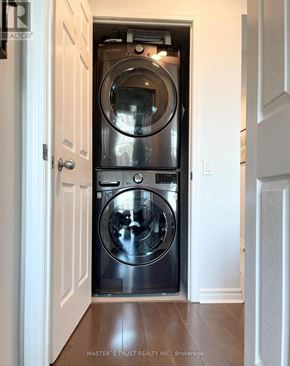 Toronto (Willowdale East) condo for rent - A washer and dryer are built into a wall in a home.
