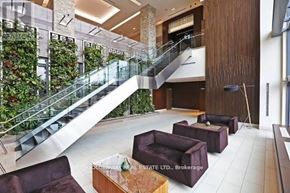 Toronto (Thorncliffe Park) condo for rent - A living wall with plants is on the side of a staircase.