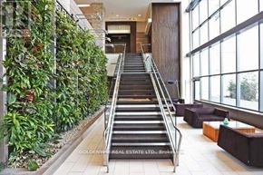 Toronto (Thorncliffe Park) condo for rent - A staircase with a green plant wall on the side.