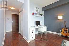 Toronto (Thorncliffe Park) condo for rent - A room with a desk, chair, and guitar.