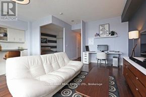 Toronto (Thorncliffe Park) condo for rent - A white couch is in the middle of a living room.