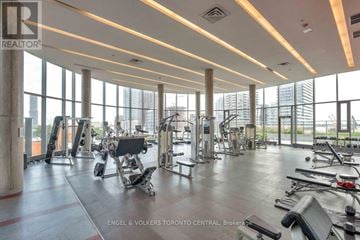 Toronto (Waterfront Communities) condo for rent - A gym with a variety of equipment is shown in the image.
