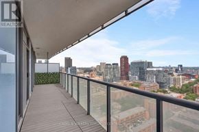 Toronto (Waterfront Communities) condo for rent - A balcony with a view of a city skyline.