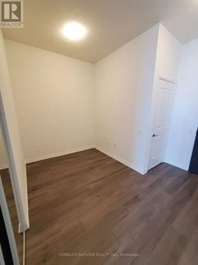 Toronto (Henry Farm) condo for rent - A room with wooden flooring and white walls.