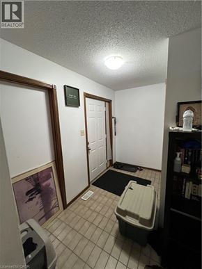 Cambridge apartment for rent - A hallway with a door on the right and a toilet in the middle.