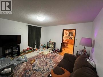 Cambridge apartment for rent - A living room with a rug on the floor and a lamp on the side table.
