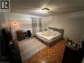 Cambridge apartment for rent - A bedroom with a bed, desk, and chair.