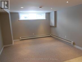 Toronto (Wexford-Maryvale) apartment for rent - A well-lit room with a window and carpeted floor.