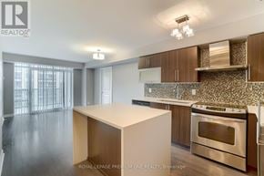 Toronto (Islington-City Centre West) condo for rent - A kitchen with a stove top oven and a counter top.