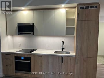 Vaughan (Concord) condo for rent - A kitchen with wooden cabinets and a stainless steel sink.