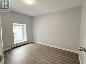 Guelph (Downtown) multi-family for rent - A room with a window and a door.