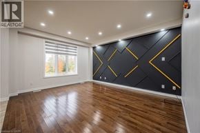 Waterloo apartment for rent - A room with wooden flooring and a black and yellow accent wall.