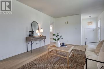 London South (South D) apartment for rent - A living room with a wooden coffee table and a white sofa.