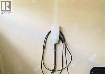 Kitchener apartment for rent - A white power strip plugged into a wall socket.