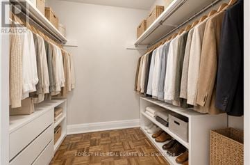 Toronto (Briar Hill-Belgravia) condo for rent - A well organized walk in closet with clothes hanging on shelves and drawers underneath.