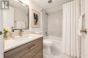 Toronto (Briar Hill-Belgravia) condo for rent - A bathroom with a sink, toilet, and bathtub.