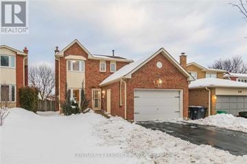 Brampton (Heart Lake East) apartment for rent - A house with a snow-covered front yard.