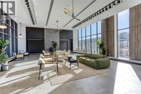 Cambridge condo for rent - A modern living room with a large window and a view of the city.