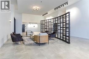Cambridge condo for rent - A living room with a black chair and a black couch.