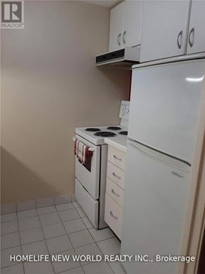 Toronto (Bay Street Corridor) condo for rent - A white fridge and dishwasher in a kitchen.
