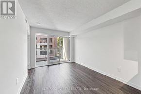 Toronto (Humber Heights) condo for rent - A spacious room with a sliding glass door leading to a balcony.