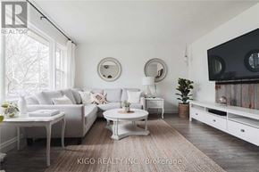 Burlington (Mountainside) apartment for rent - A living room with white furniture and a large window.