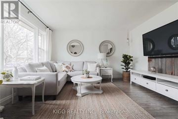 Burlington (Mountainside) apartment for rent - A living room with white furniture and a large window.