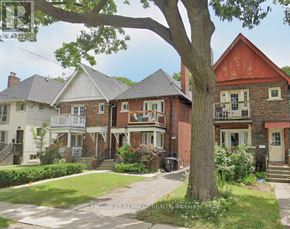 Toronto (Rosedale-Moore Park) apartment for rent - A row of houses with a tree in the front yard.