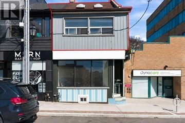 Toronto (Roncesvalles) apartment for rent - A car is parked in front of a building with a sign that says "Dynacare".