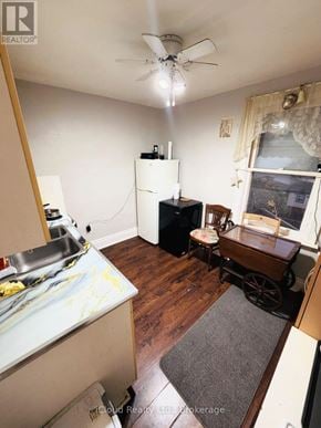 Hamilton (Crown Point) apartment for rent - A kitchen with a refrigerator, sink, and a wooden floor.