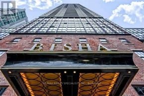 Toronto (Waterfront Communities) condo for rent - A tall building with the letters BISA on the front.