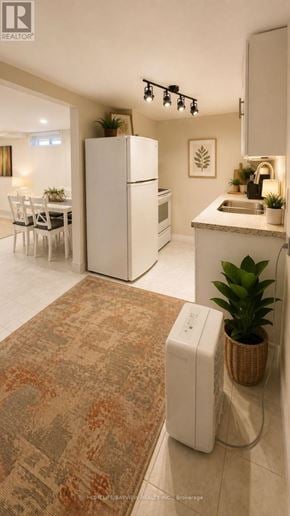 Richmond Hill (Crosby) apartment for rent - A white refrigerator is in a kitchen with a brown rug on the floor.