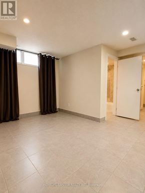 Richmond Hill (Crosby) apartment for rent - A room with a door, a window with curtains, and a tiled floor.