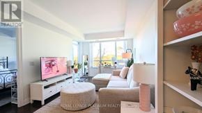Oakville (Br Bronte) condo for rent - A living room with a television and a couch.