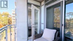 Oakville (Br Bronte) condo for rent - A balcony with a cushioned bench and glass doors.