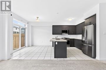 Centre Wellington (Fergus) apartment for rent - A kitchen with black cabinets and a white island.