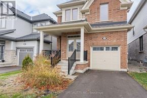 Centre Wellington (Fergus) apartment for rent - A house with a garage door and a brick wall.