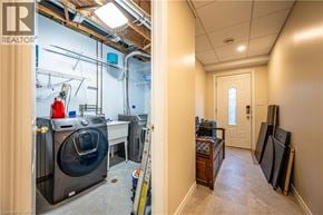 Kitchener apartment for rent - A room with a washing machine and dryer in it.